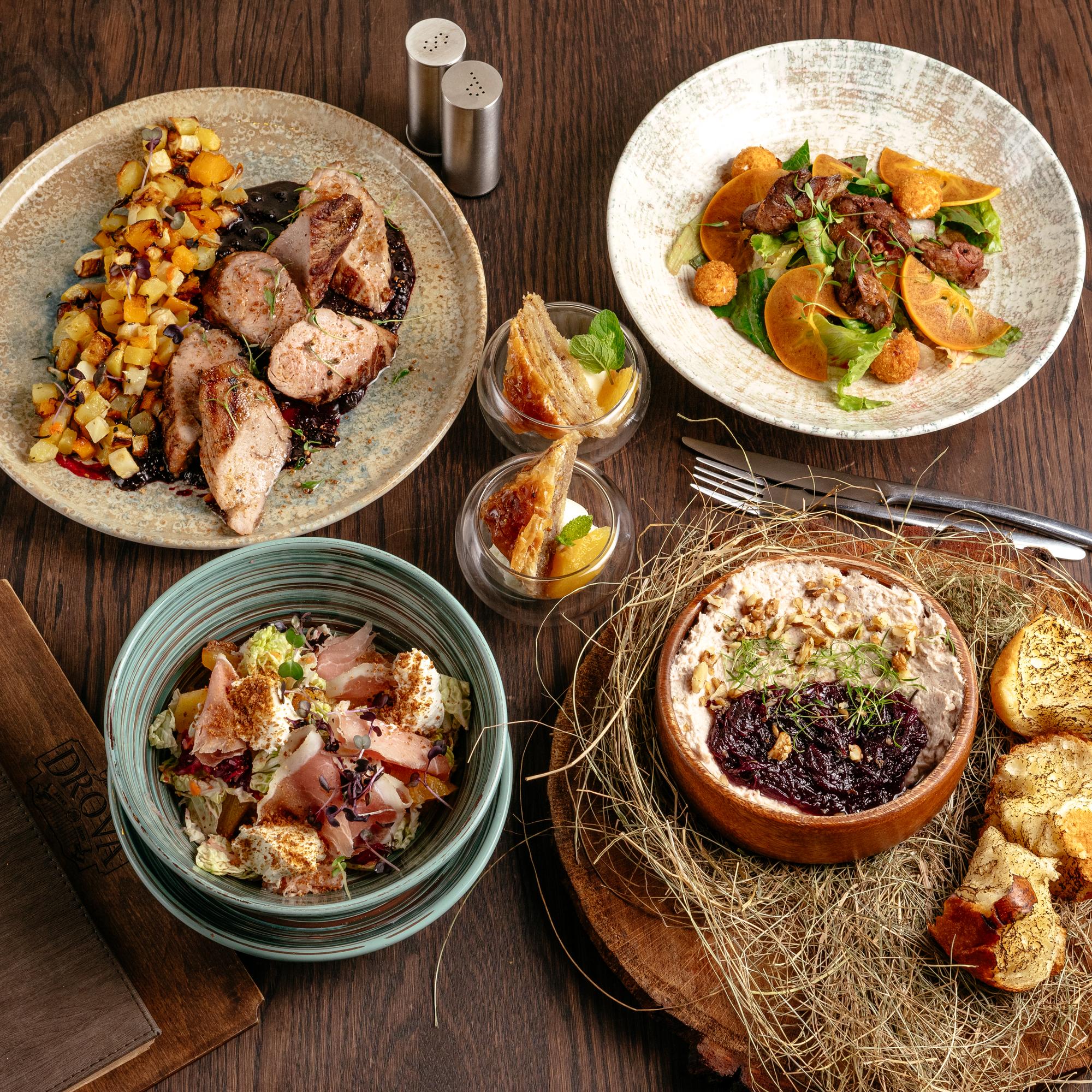Family style main course on rustic table